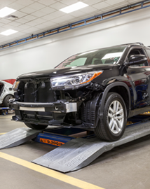 Toyota on vehicle lift | DELLA Toyota of Plattsburgh in Plattsburgh NY